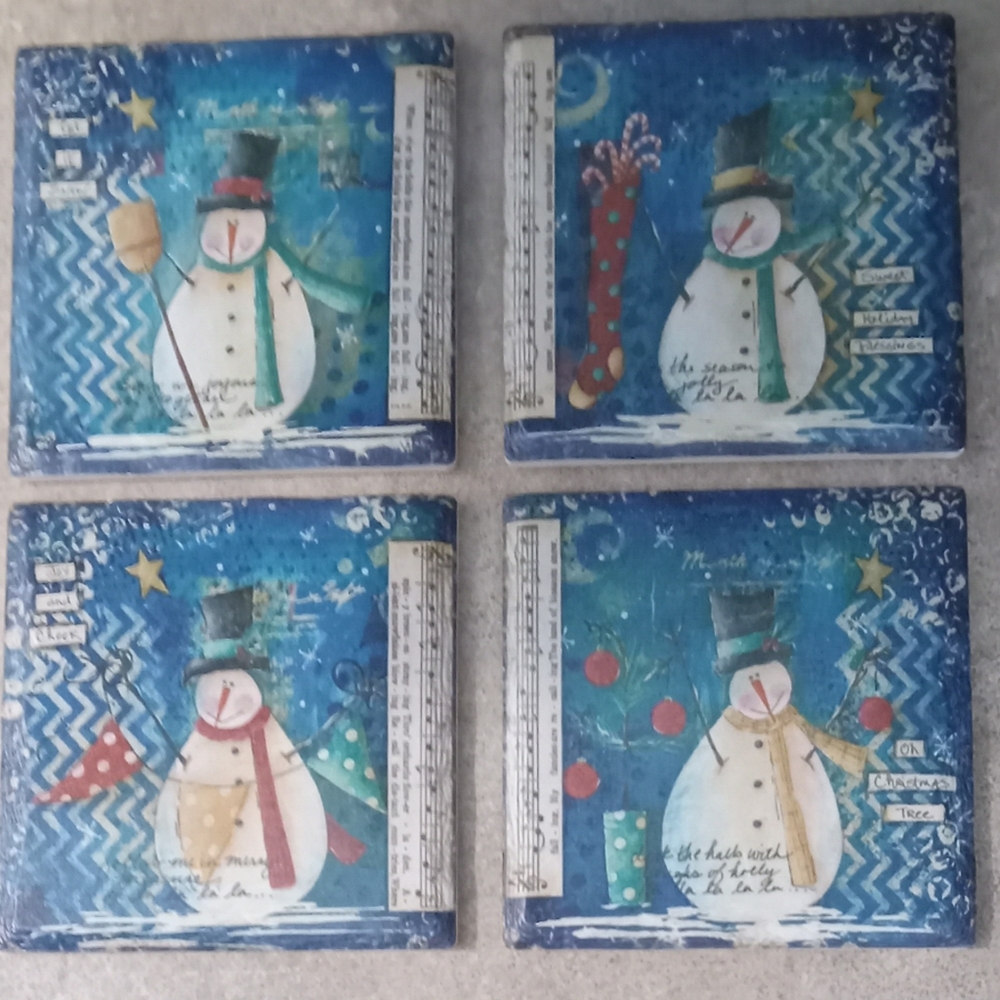 Lot of four ceramic snowman coasters
